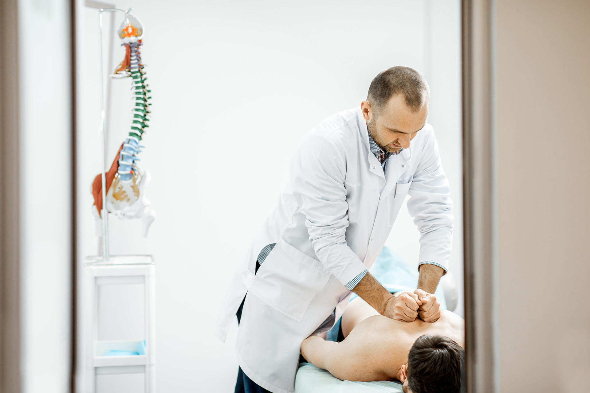 Chiropractor performing spinal adjustment at Chiro Prro clinic